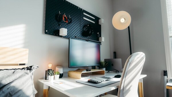 A tidy desk setup with natural light and minimal objects